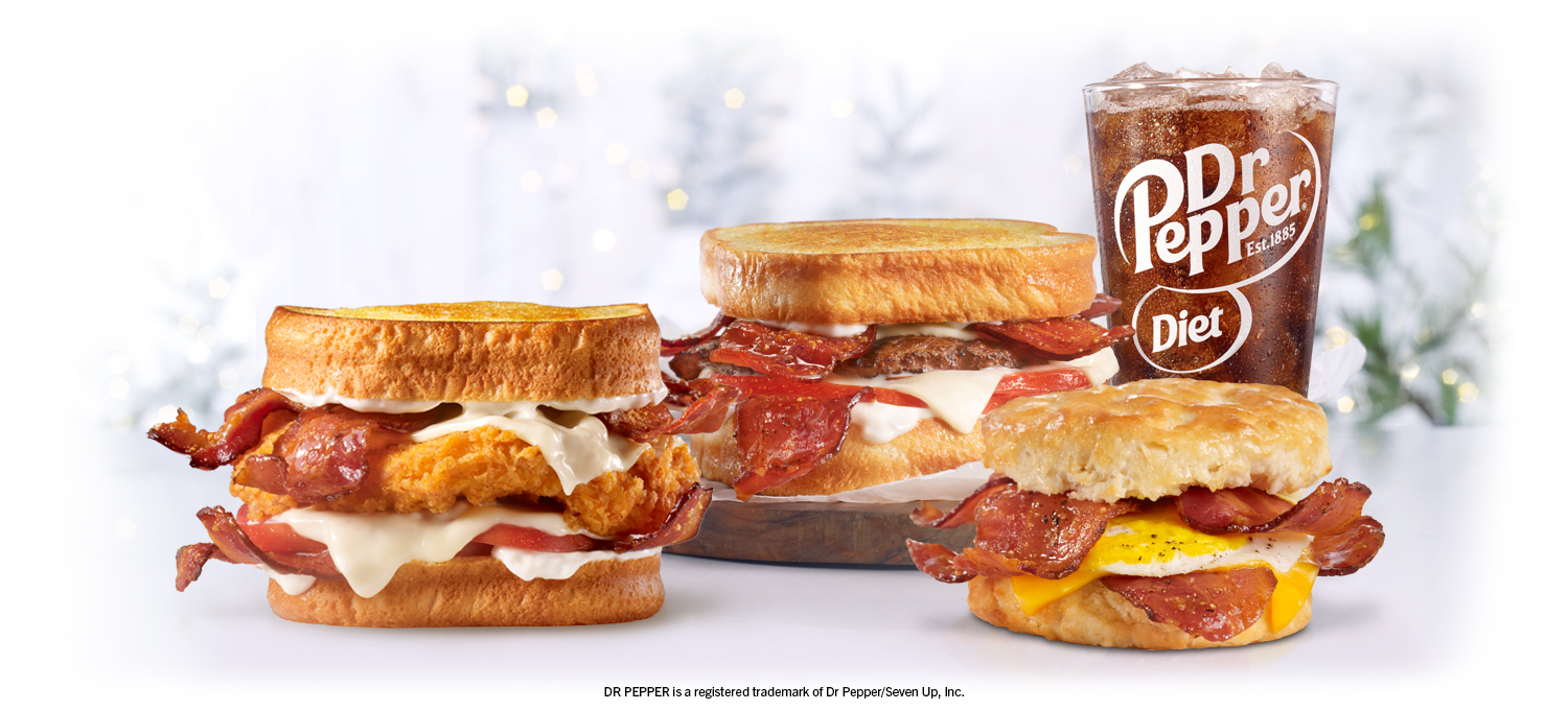 multiple hardee's sandwiches and dr pepper drink available at hardee's 